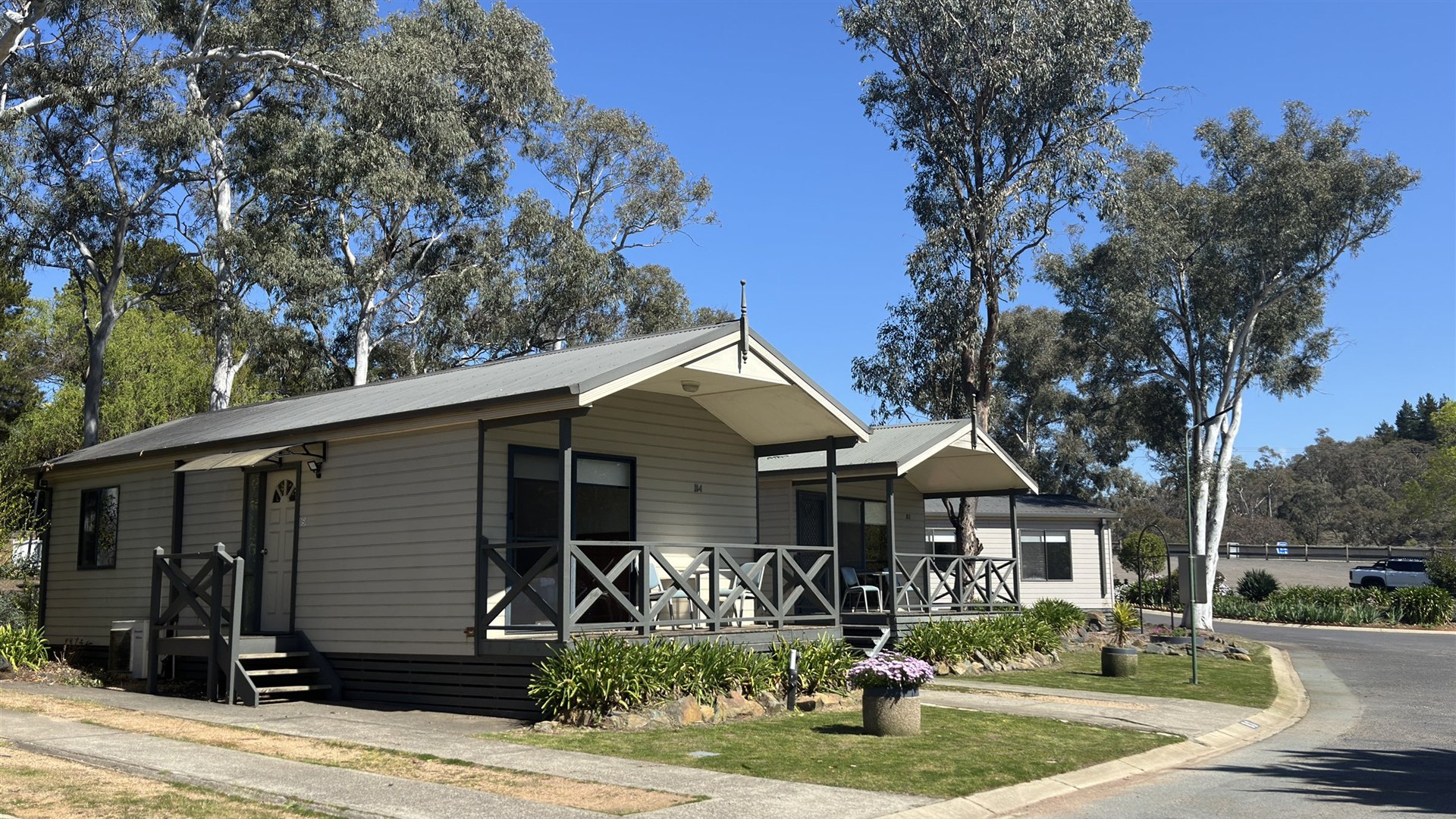 Row of Bungalows with front verandahs along a tree-lined street