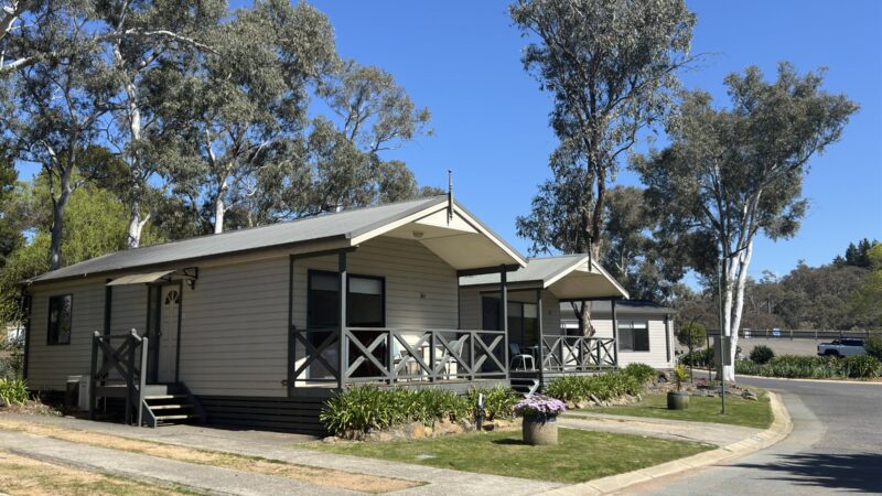 Row of Bungalows with front verandahs along a tree-lined street