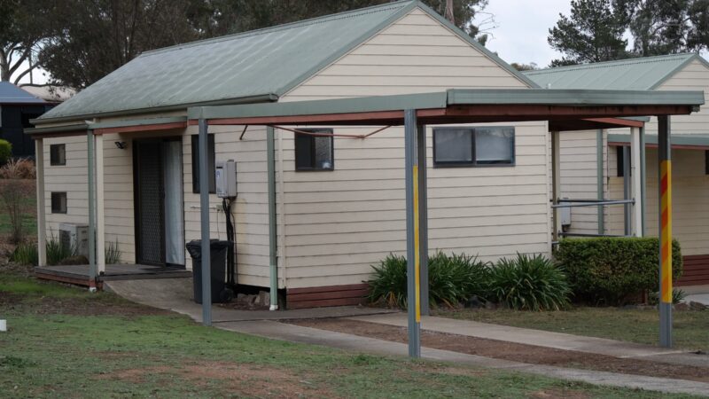 Two Bedroom Cottage exterior with weatherboard walls and a green roof