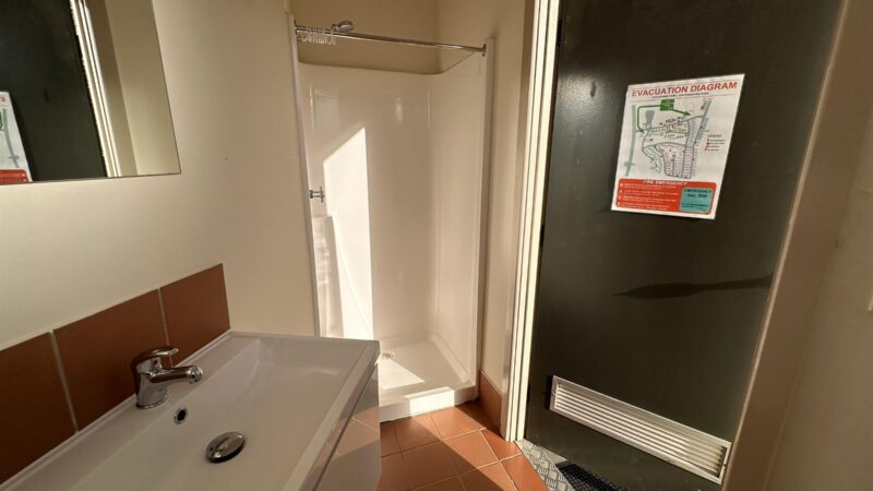 Shower and basin inside a private site ensuite