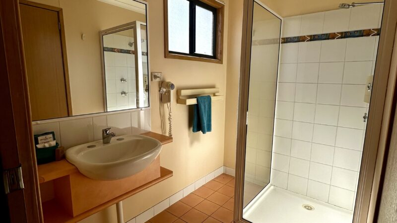 Large bungalow bathroom with a shower and basin