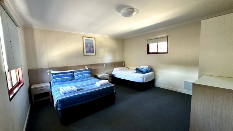 One Bedroom Villa bedroom with a double bed and a single bed