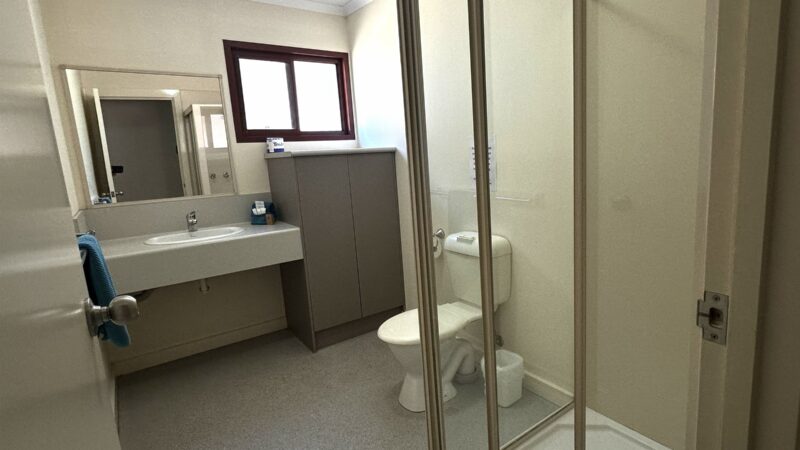 One Bedroom Villa bathroom with a large shower, grab rail and vanity