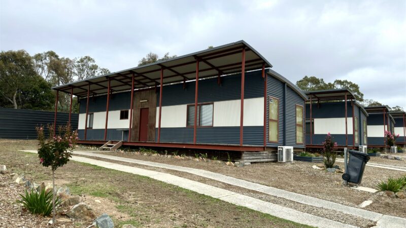 Two Bedroom Villa exterior with its long line of windows and garden bed
